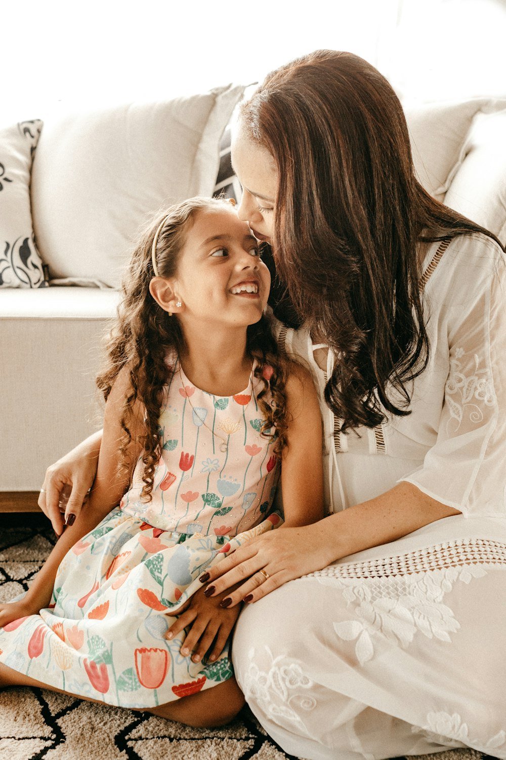 Mother and daughter smiling together
