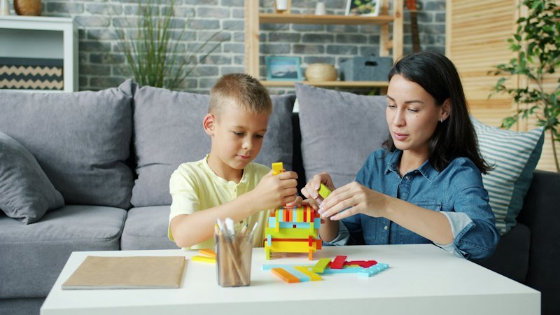 Parent and child building with blocks
